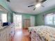 Spacious bedroom showing lots of natural light and ensuite bathroom entrance at 3013 Lime Tree Dr, Edgewater, FL 32141