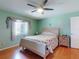 Bedroom features a ceiling fan, lots of natural light, and hardwood floors at 3013 Lime Tree Dr, Edgewater, FL 32141