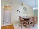 Dining room features tiled floors, a wooden table with six chairs, and stylish decor at 3013 Lime Tree Dr, Edgewater, FL 32141