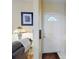 Bright entryway featuring a white front door, neutral walls, and a decorative lamp for a welcoming ambiance at 3013 Lime Tree Dr, Edgewater, FL 32141