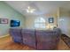 Bright living room with hardwood floors, a large window, and a comfortable sectional sofa at 3013 Lime Tree Dr, Edgewater, FL 32141