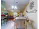 Open concept living space with dining room, kitchen and living room areas and tile flooring at 3013 Lime Tree Dr, Edgewater, FL 32141