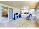 Inviting sun room with lots of natural light, tile flooring, and a comfortable rocking chair at 3013 Lime Tree Dr, Edgewater, FL 32141