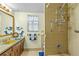 Well-lit bathroom features a sink, a shower, and cute mermaid decor at 3016 Mango Tree Dr, Edgewater, FL 32141