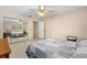Comfortable bedroom with neutral carpet and a mirrored closet for extra storage space at 3016 Mango Tree Dr, Edgewater, FL 32141
