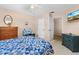 Cozy bedroom featuring matching dresser and night stand, a ceiling fan, and a television at 3016 Mango Tree Dr, Edgewater, FL 32141