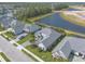 Stunning aerial view of the home showcasing its prime location near a picturesque pond and lush green surroundings at 3219 Modena Way, New Smyrna Beach, FL 32168