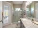 Beautiful bathroom features a walk-in shower and granite countertop vanity at 3219 Modena Way, New Smyrna Beach, FL 32168