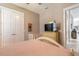 Bedroom with soft lighting, crib, and view of the backyard at 3219 Modena Way, New Smyrna Beach, FL 32168