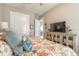 Bedroom features include a TV, closet, and view into other rooms at 3219 Modena Way, New Smyrna Beach, FL 32168