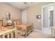 Bright bedroom features two twin beds and a window with plantation shutters at 3219 Modena Way, New Smyrna Beach, FL 32168