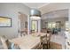 Open dining room featuring modern lighting and easy access to other living areas at 3219 Modena Way, New Smyrna Beach, FL 32168