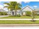 Inviting single-Gathering home with manicured lawn and lush landscaping at 3219 Modena Way, New Smyrna Beach, FL 32168