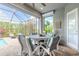 Enjoy outdoor dining on the screened lanai with serene views of the pool and lush landscaping at 3219 Modena Way, New Smyrna Beach, FL 32168