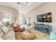 Open living room with neutral walls, area rug, furniture and view of the front door at 3219 Modena Way, New Smyrna Beach, FL 32168