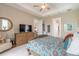 Comfortable bedroom boasts a tray ceiling, ensuite bathroom, and a spacious layout for ultimate relaxation at 3219 Modena Way, New Smyrna Beach, FL 32168