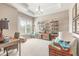 Office with neutral carpet, window, shelving, stylish decor, and a decorative light fixture at 3219 Modena Way, New Smyrna Beach, FL 32168