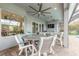 Covered patio with ceiling fans, outdoor dining, and comfortable seating is perfect for entertaining at 3219 Modena Way, New Smyrna Beach, FL 32168