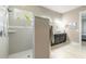 Large tiled walk-in shower, with window, in primary bathroom at 3219 Modena Way, New Smyrna Beach, FL 32168