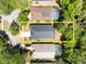 Aerial view of the property with yellow outline showcasing the backyard and proximity to neighboring homes at 3349 Glenshane Way, Ormond Beach, FL 32174