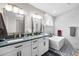 Modern bathroom featuring double sinks, and a luxurious freestanding tub with stylish fixtures and finishes at 3349 Glenshane Way, Ormond Beach, FL 32174