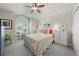 Comfortable bedroom featuring a queen bed, shuttered window, and closet for ample storage at 3349 Glenshane Way, Ormond Beach, FL 32174