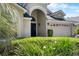 Charming single-story home with elegant front door, manicured landscaping and well-maintained lawn at 3349 Glenshane Way, Ormond Beach, FL 32174