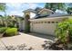 Charming single-story home featuring a well-maintained lawn, mature landscaping and a two-car garage at 3349 Glenshane Way, Ormond Beach, FL 32174
