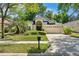 Charming single-story home featuring a well-maintained lawn, mature landscaping and a two-car garage at 3349 Glenshane Way, Ormond Beach, FL 32174