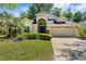 Charming single-story home featuring a well-maintained lawn, mature landscaping and a two-car garage at 3349 Glenshane Way, Ormond Beach, FL 32174