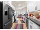 Modern kitchen featuring stainless steel appliances, breakfast nook, white cabinets, and a cozy dining area at 3349 Glenshane Way, Ormond Beach, FL 32174