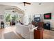 Bright and airy living room featuring hardwood floors, sliding glass doors, and comfortable seating for relaxation and entertainment at 3349 Glenshane Way, Ormond Beach, FL 32174