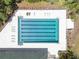 Aerial view of community pool with plenty of lounge chairs and space to relax at 3349 Glenshane Way, Ormond Beach, FL 32174