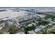Scenic aerial view of Admiralty Club condominiums near bridge, highlighting the property's proximity to the water and local streets at 3606 S Peninsula Dr # 509, Port Orange, FL 32127