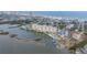 Aerial view of a waterfront condo community featuring stunning water views and a community pool at 3606 S Peninsula Dr # 509, Port Orange, FL 32127