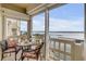 Balcony view with table set for wine and offers amazing views of the water at 3606 S Peninsula Dr # 509, Port Orange, FL 32127