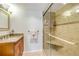 Bathroom boasts granite countertop vanity and tiled shower with a built-in bench seat at 3606 S Peninsula Dr # 509, Port Orange, FL 32127