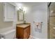 Bathroom features a granite countertop, vanity, framed mirror, and tiled shower at 3606 S Peninsula Dr # 509, Port Orange, FL 32127