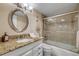 The bathroom has a granite vanity and a shower with glass doors, providing a stylish and functional space at 3606 S Peninsula Dr # 509, Port Orange, FL 32127