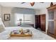Cozy bedroom with comfortable furniture, water views, and a ceiling fan at 3606 S Peninsula Dr # 509, Port Orange, FL 32127