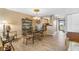 Dining room boasts a glass table and offers easy access to the kitchen at 3606 S Peninsula Dr # 509, Port Orange, FL 32127