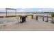 Community waterfront dock equipped with a grill, perfect for enjoying the outdoors at 3606 S Peninsula Dr # 509, Port Orange, FL 32127
