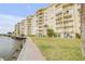 Luxury waterfront condominium with private balconies and manicured green space along the water at 3606 S Peninsula Dr # 509, Port Orange, FL 32127