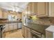 Well-lit kitchen with granite countertops, stainless steel appliances, and ample cabinet space at 3606 S Peninsula Dr # 509, Port Orange, FL 32127
