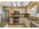 Renovated kitchen with stainless steel appliances, granite countertops, and ample cabinet storage at 3606 S Peninsula Dr # 509, Port Orange, FL 32127
