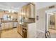 Updated kitchen features light wood cabinets, granite countertops, and modern appliances at 3606 S Peninsula Dr # 509, Port Orange, FL 32127