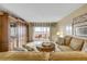 Comfortable living room featuring water views from the sliding door to the balcony at 3606 S Peninsula Dr # 509, Port Orange, FL 32127