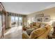 Bright living room with sliding glass doors to a balcony that provides stunning views at 3606 S Peninsula Dr # 509, Port Orange, FL 32127
