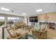 This cozy living room features comfortable seating and views of the water at 3606 S Peninsula Dr # 509, Port Orange, FL 32127