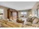 Comfortable living room featuring water views from the sliding door to the balcony at 3606 S Peninsula Dr # 509, Port Orange, FL 32127